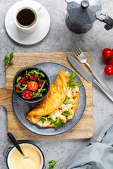 Fluffy omelet with cauliflower for breakfast with a cup of coffee