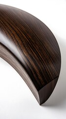 A wooden object with a curved shape and a brown color