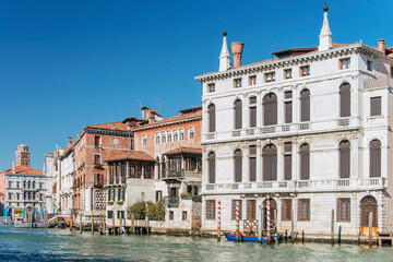 The Grand Canal, with gondolas, boats, ancient buildings and palaces. It is the main navigation channel linking Basin São Marcos to the Santa Lucia railway station. Venice, Italy, 2019