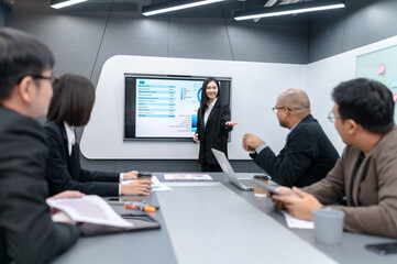 Businessman, woman and man presenting, office meeting with documents, laptop, sales planning, digital marketing and growth strategy, analysis with colorful charts and graphs about sales planning.