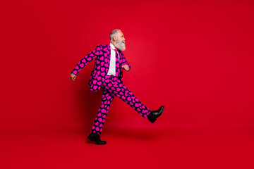 Full length body size view of nice attractive funky serious white-haired man cherub strolling going date meet isolated on bright vivid shine vibrant red color background