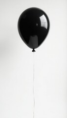 Obraz premium Black balloon against pure white, thin string attached , hope, event, subtle
