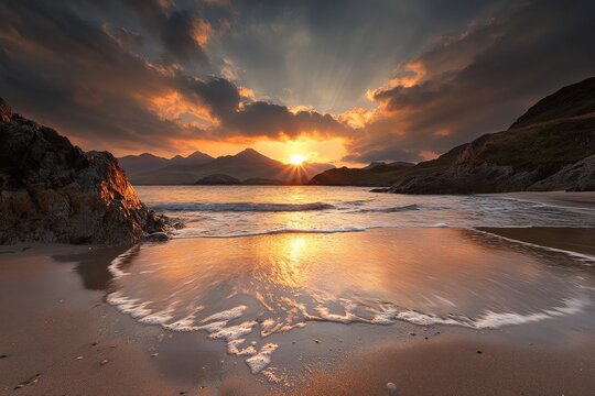 Majestic sunset over rocky coastline with golden waves reflecting light near mountains
