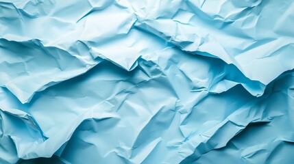 Obraz premium Wrinkled blue paper surface with light source