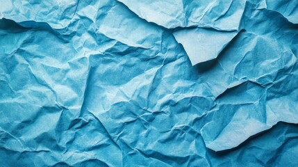 Obraz premium Crumpled blue paper background texture design