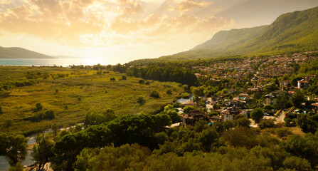 The beginning of autumn in Akyaka holiday village. Azmak River and the Gulf of Gokova. Akyaka is a...