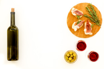 Prosciutto with rosemary and glass of wine. Traditional Spanish meal