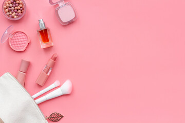 Makeup accessories - brushes and pink pastel cosmetic products, flat lay, top view