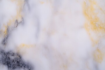 Smooth marble texture with subtle yellow and gray veins