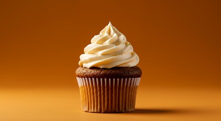 Delicious Cupcake with Vanilla Frosting on Orange Background, a Sweet Treat