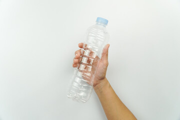 Hand Holding Clear Plastic Water Bottle isolated on white background