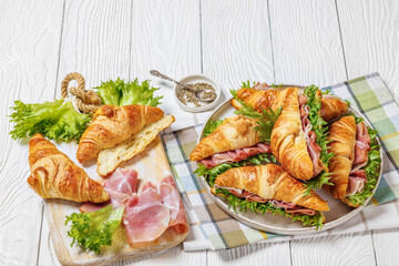 croissant sandwiches with ham and lettuce on plate