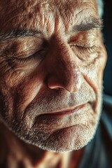 Obraz premium Elderly man with eyes closed in serene moment