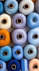 Vibrant spools of thread bring life to a sewing studio's wall, inviting creativity in the cloth industry workspace