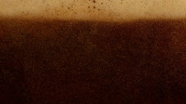 Super Slow Motion Detail Shot of Pouring Fresh Creamy Coffee at 1000fps.