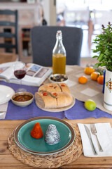 Beautiful and stylish table serving of homemade goat cheese crafted into unique shapes, featuring natural coatings like spices and herbs for a gourmet touch. Craft cheese and bread making