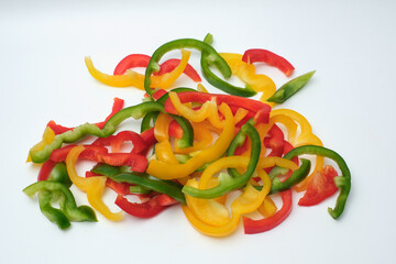 Pepper cut into strips on white background
