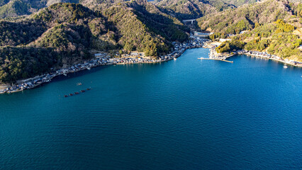 Obraz premium Aerial View of Coastal Fishing Village and Floating Fish Farms, Ine Bay, Kyoto, Japan