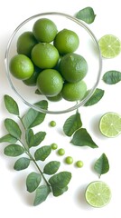 Fresh Limes in Glass Bowl with Leaves and Halves
