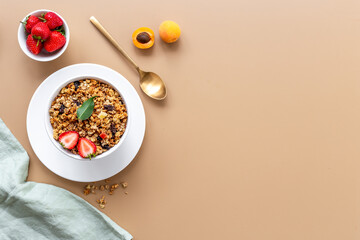 Top view of breakfast with oatmeal granola and ingredients. Healthy morning routine