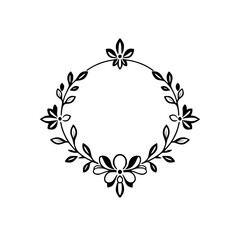 Wreath: A detailed floral wreath of flowers, and leaves with a circular frame, in black and white.