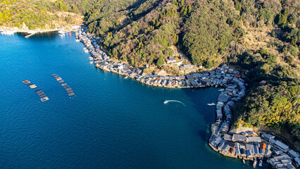 Fototapeta premium Aerial View of Coastal Fishing Village and Floating Fish Farms, Ine Bay, Kyoto, Japan