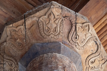 Khiva, Uzbekistan - October 14, 2024: Old Djuma Mosque close up of ancient carved wood column top