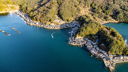 Naklejka premium Aerial View of Coastal Fishing Village and Floating Fish Farms, Ine Bay, Kyoto, Japan