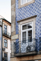 Close-up of a facade in Porto covered with traditional ceramic tiles (azulejos)