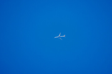 a passenger plane in a clear blue sky