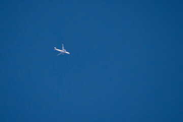 a passenger plane in a clear blue sky