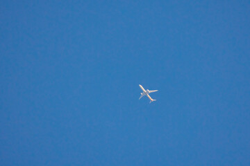 a passenger plane in a clear blue sky