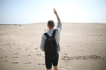 Young man in desert landscape
