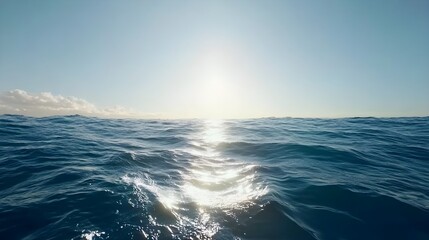 Obraz premium Calm Pastel Blue Water Surface with Ripples Under Bright Sunlight