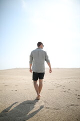 Young man in desert landscape