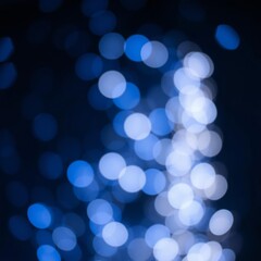 Abstract blue bokeh lights on a dark background creating a serene and mystical atmosphere perfect for holiday or celebration themes Bokeh light lights background bokeh abstract light bright ef