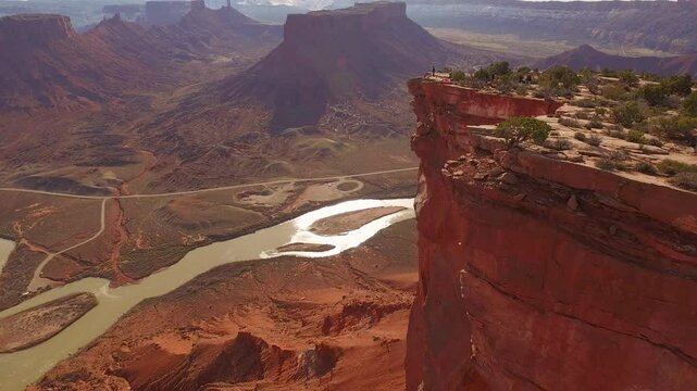 Cinematic drone shot moving backwards over southern Utah rocky cliffside
