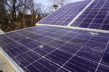 Broken solar panel with cracks and a hole from a bullet or shrapnel