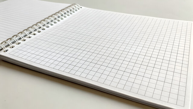 Spiral notebook with grid paper for organization and creative writing