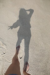 A woman's shadow on the beach