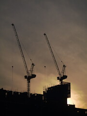construction site with crane sunset