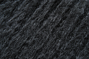 Black chunky fluffy wool jersey fabric texture as background