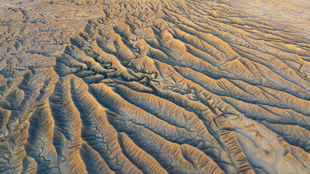 Golden textures of eroded valleys in Caineville Mesa, Utah