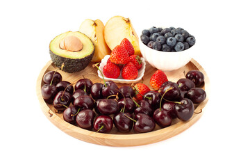 mix fruits on wooden plate