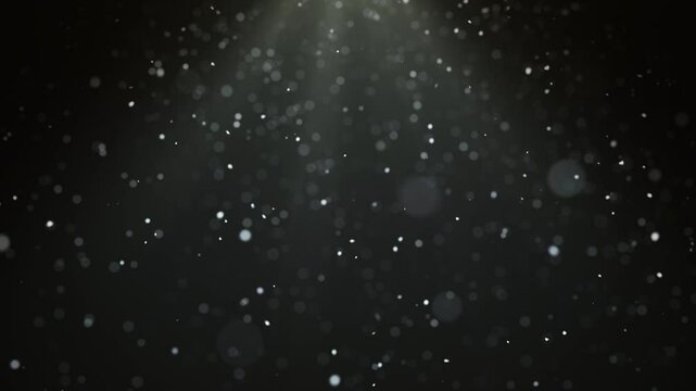 Realistic snowfall animation with seamless loop on black background under spotlight. Snowflakes bokeh and snowfall for Christmas and holiday design.