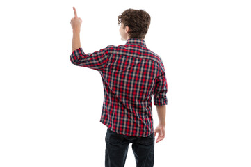 A young man in a plaid shirt pointing upward against a white background.
