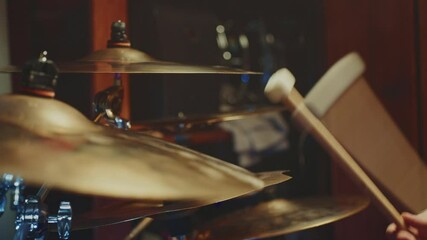 Drummer showcases skill with powerful cymbal technique in studio