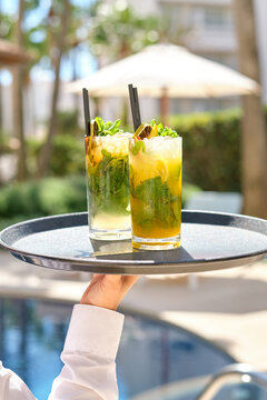 Refreshing cocktails served poolside on a sunny afternoon