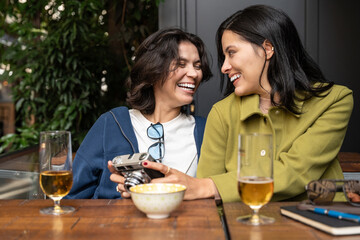 Happy couple enjoying a cozy moment with drinks and laughter