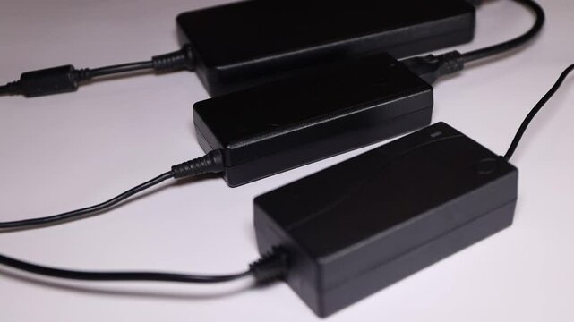 black adapters for laptop. Different types chargers 
